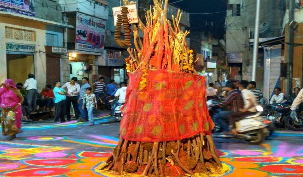 worship around fire for traditional Holika Dahan in pali