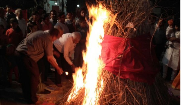 worship around fire for traditional Holika Dahan in pali