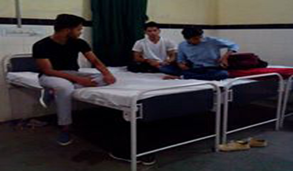 tourist on bed of male ward of mount abu hospital