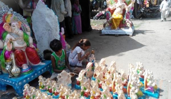 little hands decorating ganpati in sirohi