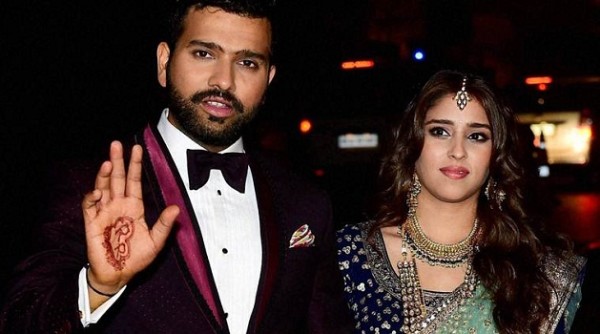 Mumbai: Newly wed couple cricketer Rohit Sharma and Ritika Sajdeh pose for a photo at their wedding venue in Mumbai on Sunday. PTI Photo by Mitesh Bhuvad(PTI12_13_2015_000236B)