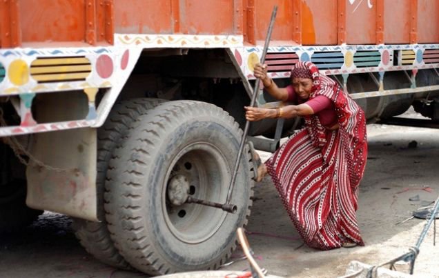 Meet a woman who does alone repairing the trucks