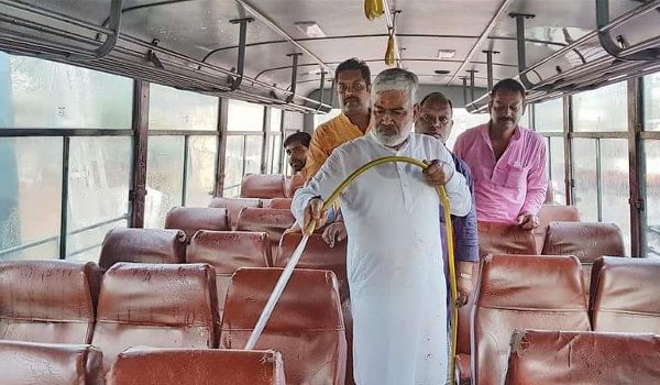 UP Transport minister Swatantra Dev Singh himself cleans roadways bus in varanasi