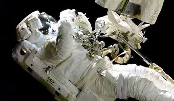 Two US astronauts conduct 7 hour spacewalk outside space station ISS