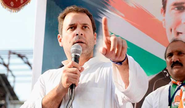Rahul gandhi takes dig at Modi over corruption, Congress demands Rupani's removal