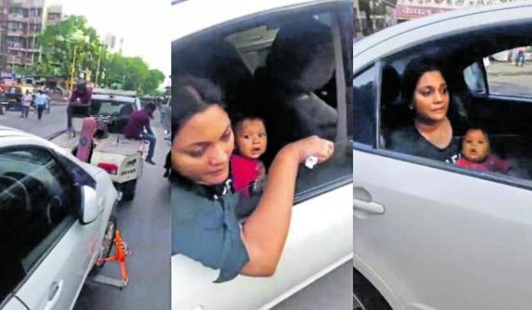 कार में बच्चे को दूध पिला रही महिला को कार समेत टो किया कार में बच्चे को दूध पिला रही महिला को कार समेत टो किया
