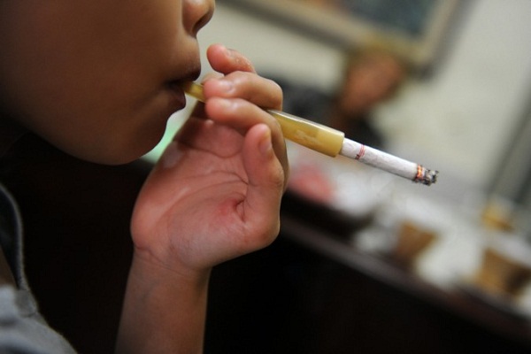 Parents in this country are encouraging the children to smoke cigarettes