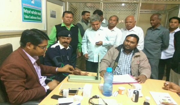 Medical team screening health of employee of sirohi collecterate