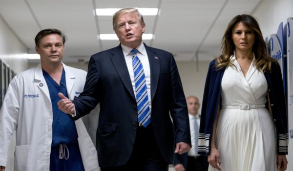 Donald Trump meets school shooting victims during visit to Florida hospital