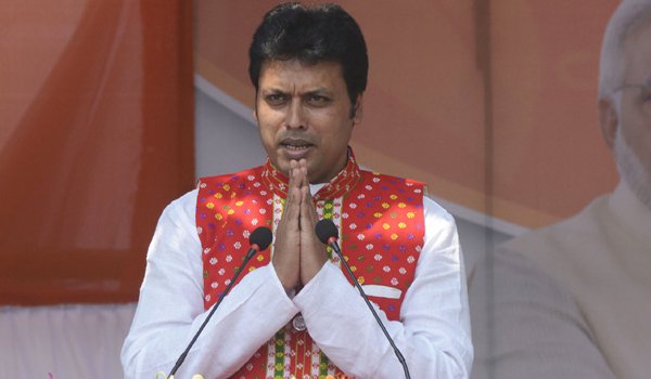 Biplab Deb Touches Manik Sarkar's Feet at Swearing-in