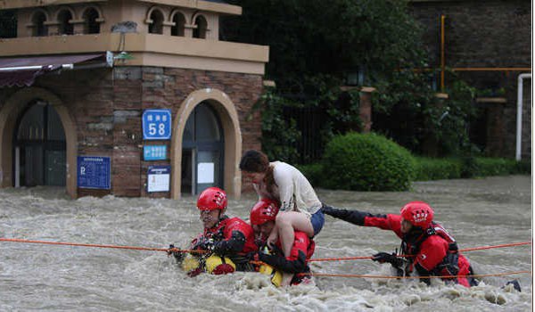 China floods wreak havoc, block roads and railways; more rain due