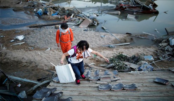 Japan struggles to deliver food relief after historic rains